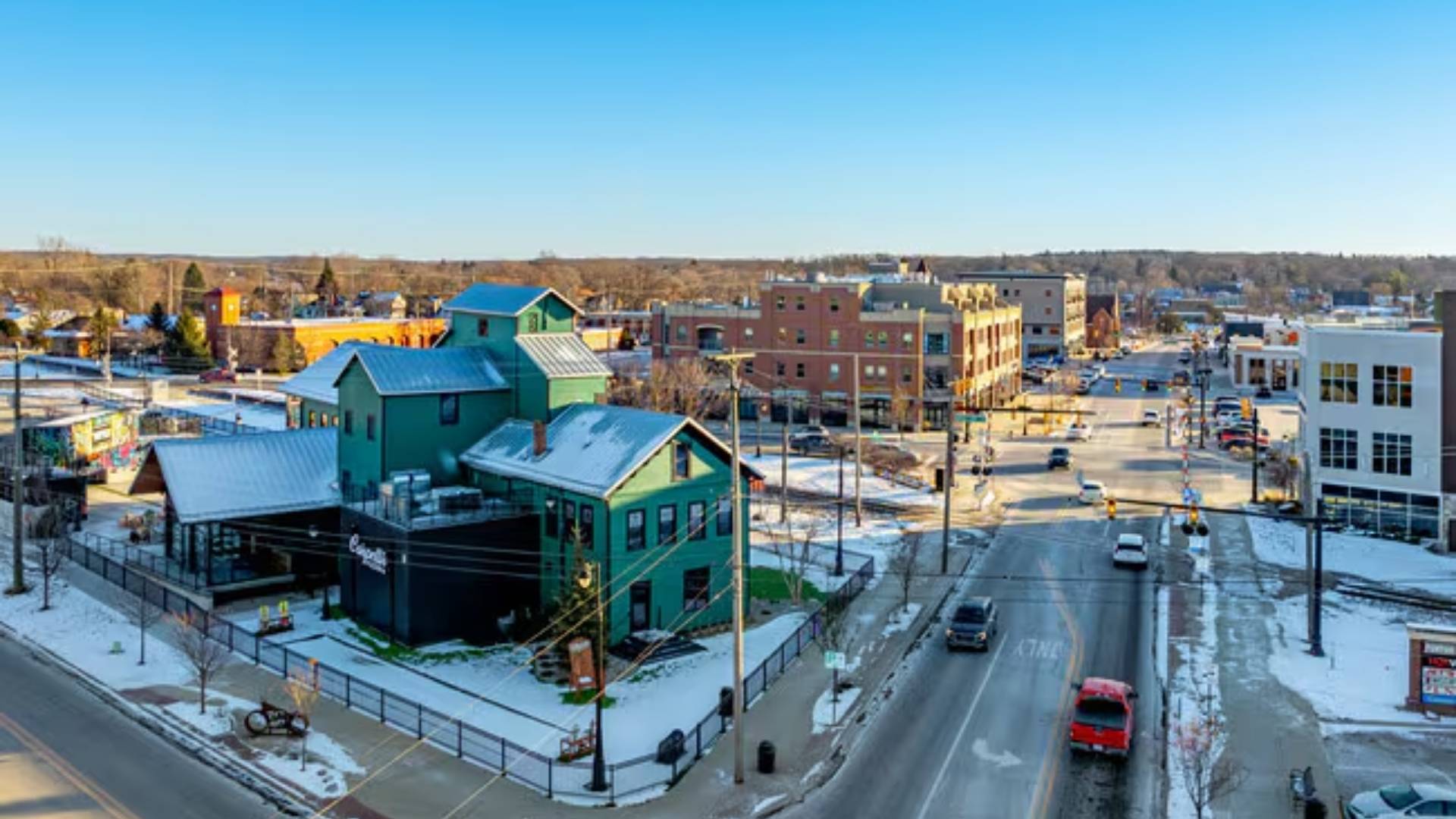 Downtown area with blue green barn structure in an urban city