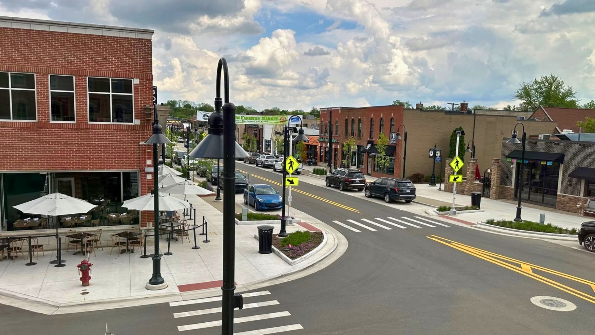 A small downtown street with brick buildings