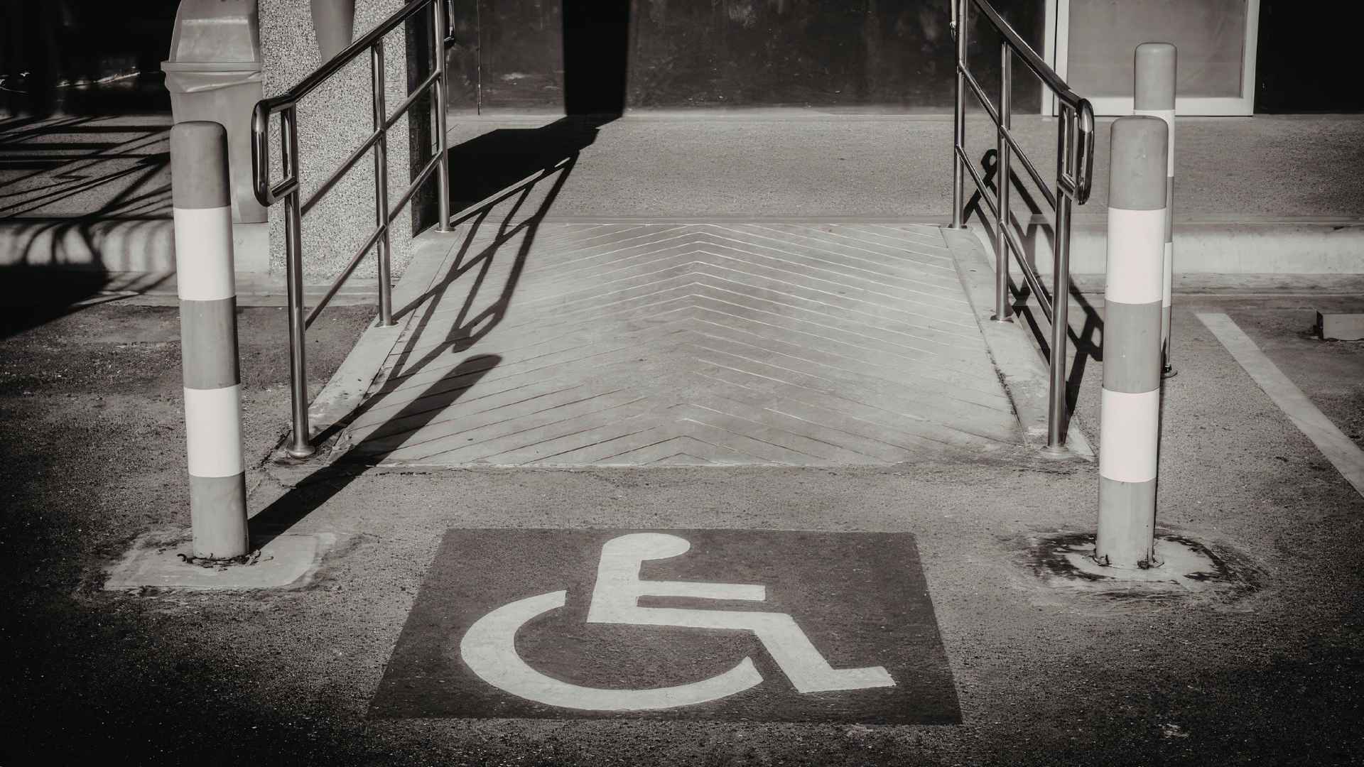A wheelchair accessibility symbol is painted on the ground